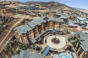 Bird's eye view of apartment complex and mountains
