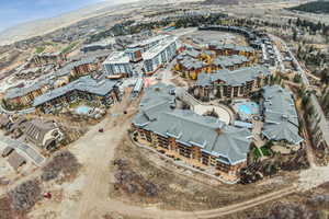 Aerial view of a pool area and apartment complex
