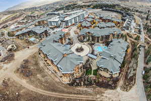 Aerial overview of property's location with a pool area