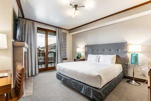 Bedroom 2 with access to outside and ornamental molding