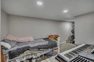 Bedroom featuring recessed lighting and wood finished floors
