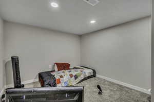 Bedroom with carpet flooring and recessed lighting