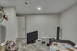 Workout room with carpet and recessed lighting