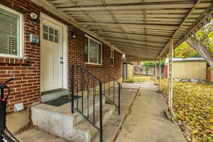 View of patio / terrace featuring a shed