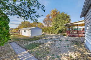 View of yard with an outbuilding