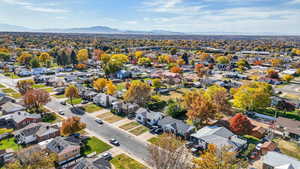Aerial perspective of suburban area with a mountainous background