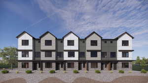 Contemporary home featuring brick siding and stucco siding