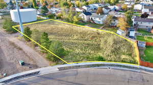 Aerial view of residential area featuring property boundaries highlighted