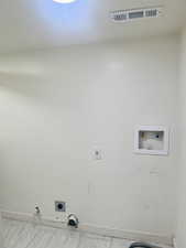 Laundry area featuring hookup for a gas dryer and hookup for a washing machine