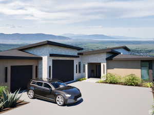 Rendering of example contemporary house featuring stone siding, a mountain view, a garage, and concrete driveway