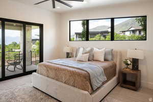 Example of Bedroom featuring a mountain view, access to exterior, ceiling fan, carpet flooring, and recessed lighting