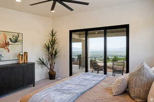 Example of carpeted bedroom featuring recessed lighting, access to exterior, and a ceiling fan