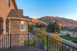 Balcony off of master bedroom with a mountain view
