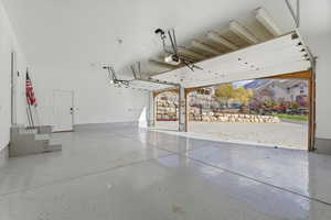 Garage with a garage door opener epoxy floors and insulated doors