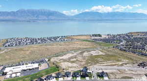 Aerial perspective of suburban area featuring a water and mountain view