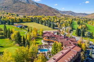 Aerial view of a mountainous background and a golf club