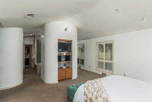 Primary bedroom looking into the primary bathroom suite.