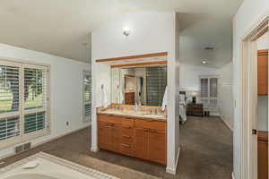 Primary bathroom looking back toward bedroom.