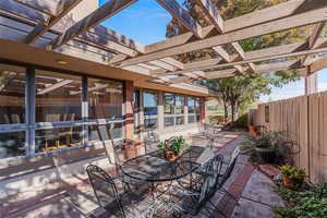 View of patio featuring outdoor dining space and a pergola