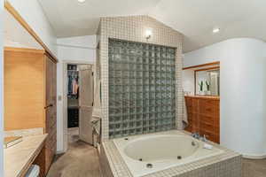 Primary bathroom jetted tub. The door on the left is to the walk-in closet.