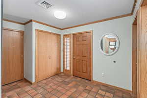 Back of hallway with door leading to side yard.