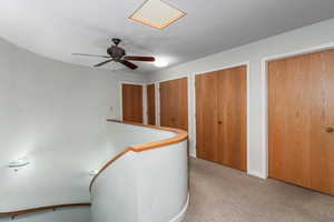 Upstairs landing area looking into 2 of the 3 bedrooms, plus storage closets.