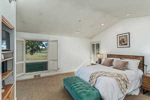 Primary bedroom with views of the golf course.