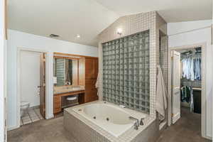 Primary bathroom jetted tub. The open door on the right is to the walk-in closet.