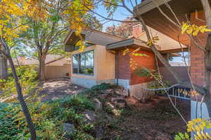 View of property exterior with brick siding