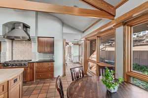 Kitchen with stainless steel gas stovetop