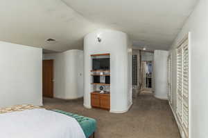 Primary bedroom looking into the primary bathroom suite.