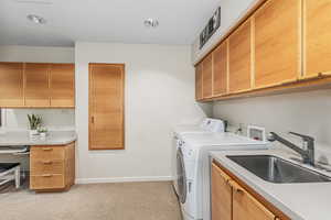 Laundry room with a foldout ironing board and extra workspace.