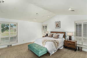 Primary bedroom with views of the golf course.