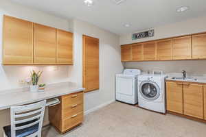 Laundry room with a foldout ironing board and extra workspace.