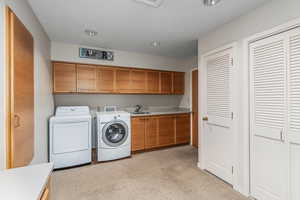 Laundry room with extra closet storage.