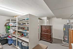 Storage area with electric water heater