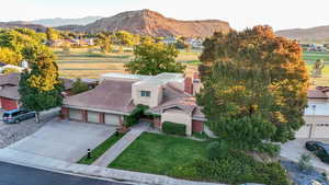 Aerial view of property and surrounding area featuring Bloomington Country Club Golf Course in the background.