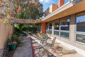 Fenced backyard featuring a patio area and outdoor dining area