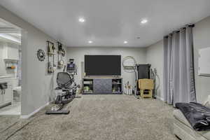 Workout room with carpet floors, recessed lighting, and electric panel
