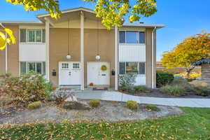Traditional-style home with brick siding