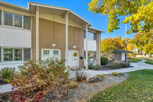 View of front of house with a front yard and brick siding