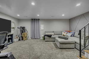 Living room with carpet floors and recessed lighting