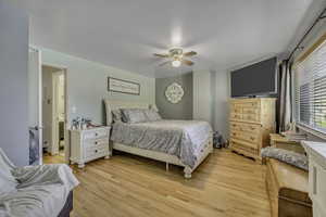 Bedroom featuring light wood-type flooring and a ceiling fan