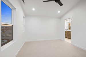 Unfurnished room with light colored carpet, recessed lighting, and a ceiling fan