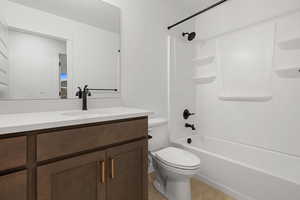 Full bath featuring vanity and shower / bath combination