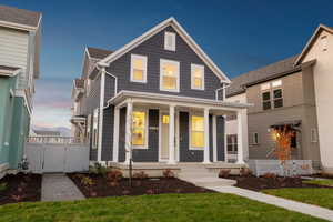 View of front facade with a gate and a porch
