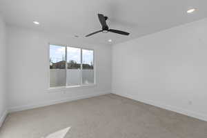 Empty room with carpet flooring, recessed lighting, and ceiling fan