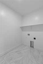 Washroom featuring light marble finish floors, hookup for a washing machine, and hookup for an electric dryer