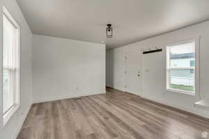 Foyer entrance with light wood finished floors
