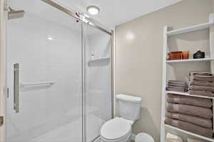 Ensuite Full bath with a stall shower and toilet